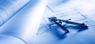Photo of blue prints with a geometric compass.